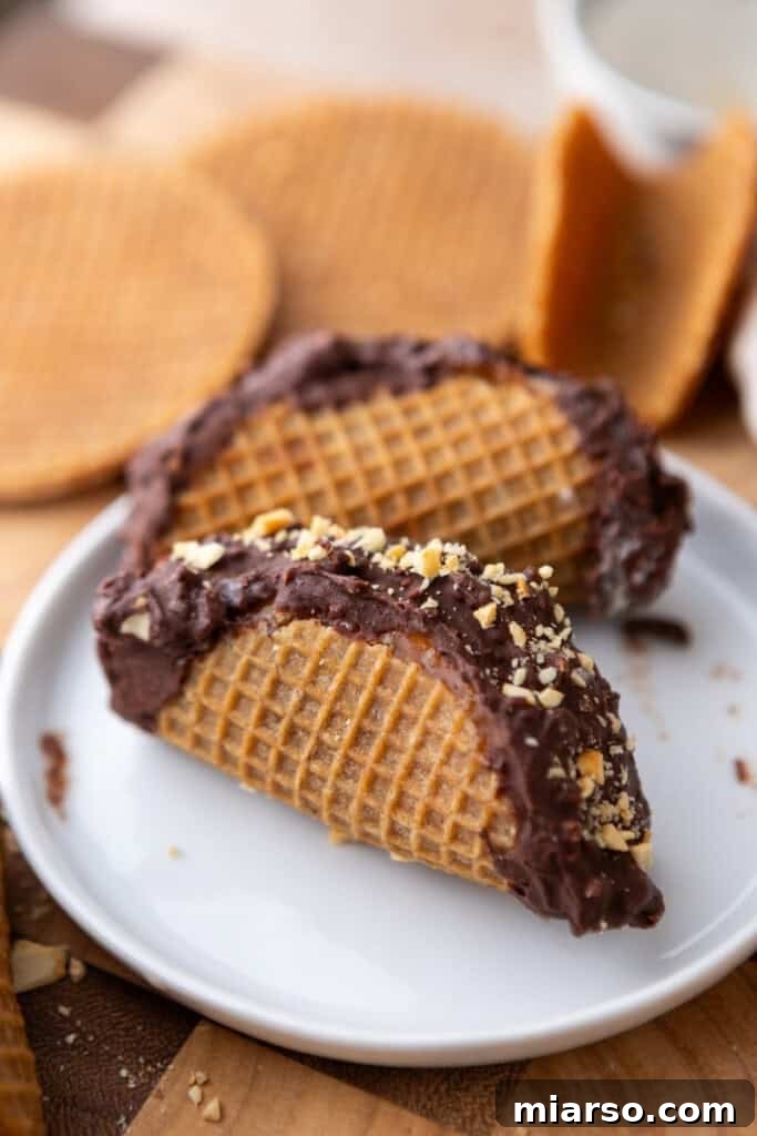 Three Stroopwafel Choco Tacos artfully arranged on a white plate