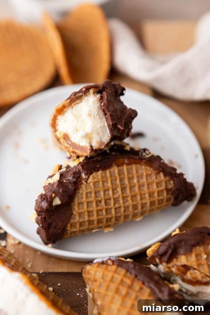A finished Stroopwafel Choco Taco being placed on a plate