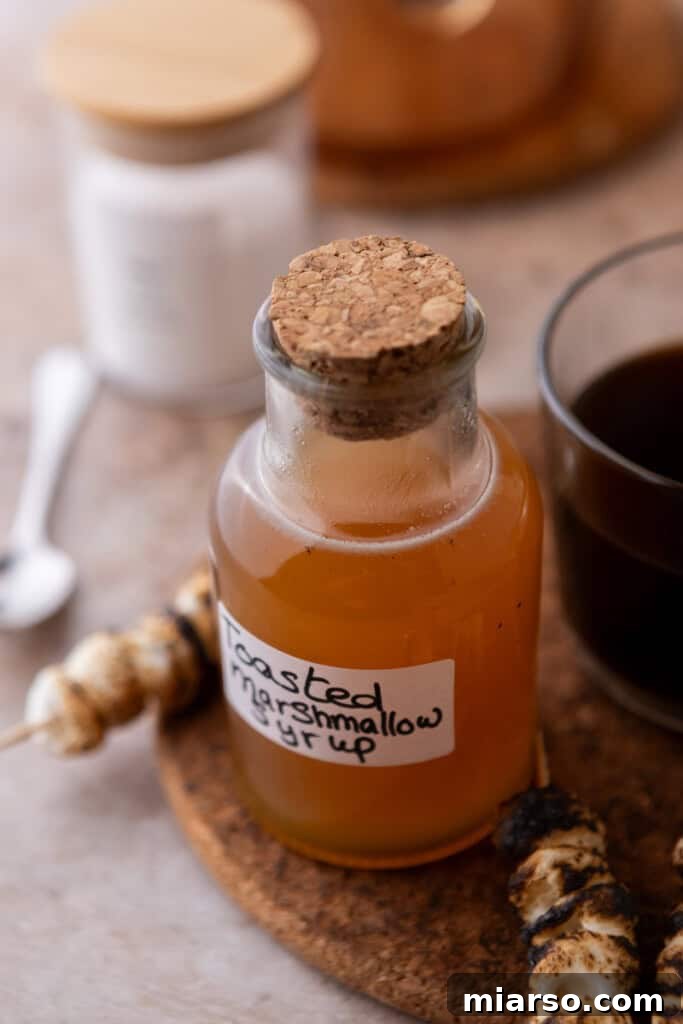 A neatly labeled jar of homemade toasted marshmallow syrup, ready for gifting or enjoying.