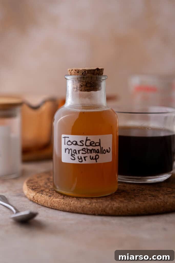 A sealed jar of homemade toasted marshmallow syrup, ready for storage.