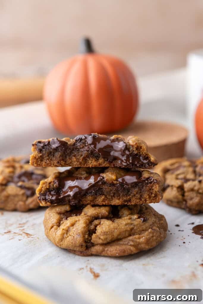 Brown Butter Pumpkin Chocolate Chip Cookies on parchment paper stacked