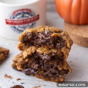 Brown Butter Pumpkin Chocolate Chip Cookies on parchment paper stacked