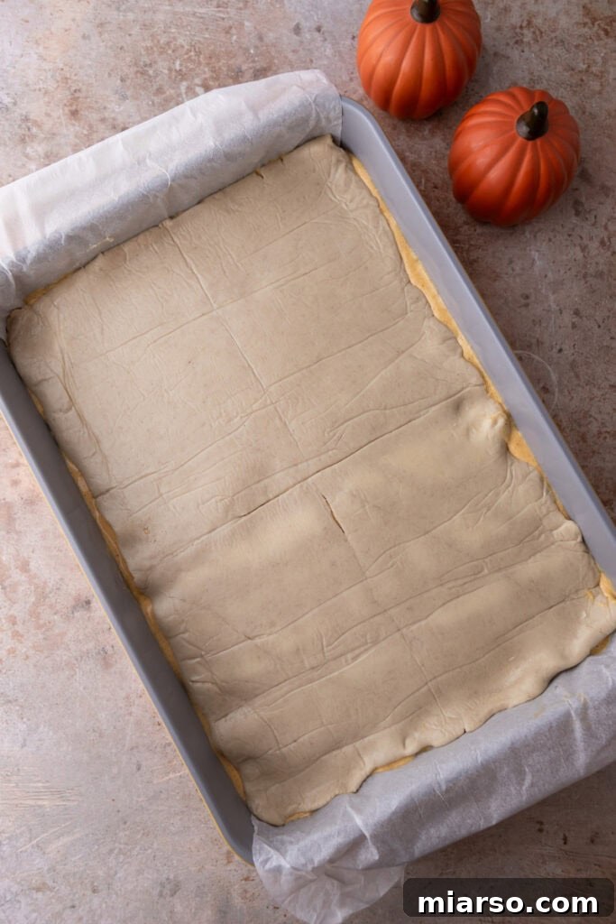 Second layer of croissant dough placed on top of the pumpkin filling