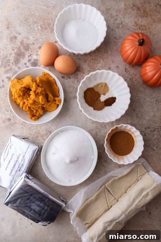 Various ingredients laid out for churro pumpkin cheesecake bars recipe