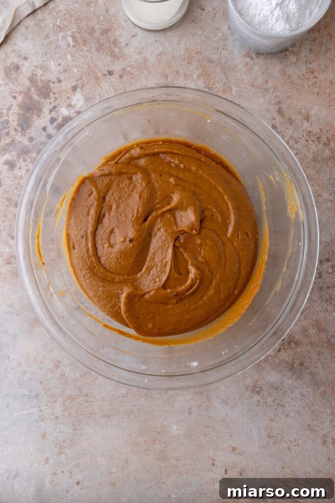 Warm Autumn Pumpkin Streusel Loaf 12 mixed ingredients in a bowl