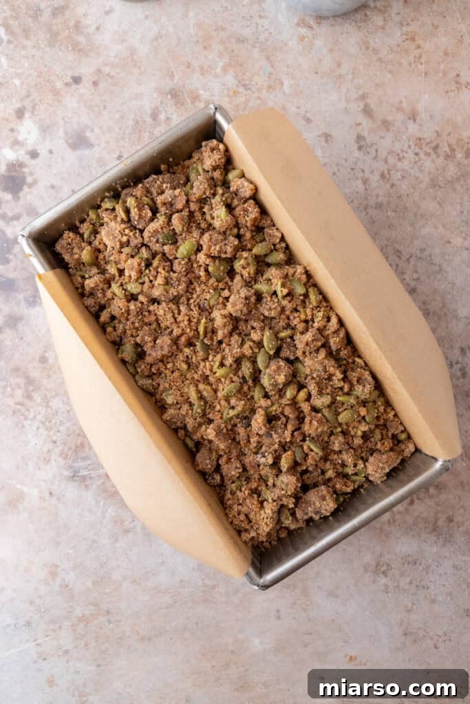 Warm Autumn Pumpkin Streusel Loaf 14 baked batter in a pan