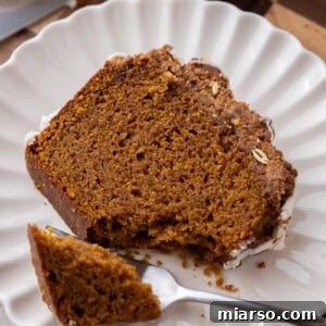 Warm Autumn Pumpkin Streusel Loaf 18 streusel pumpkin bread slice on a plate