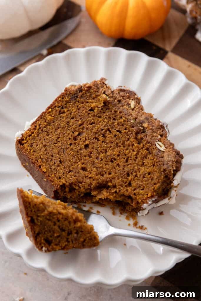 Warm Autumn Pumpkin Streusel Loaf 4 streusel pumpkin bread slice on a plate