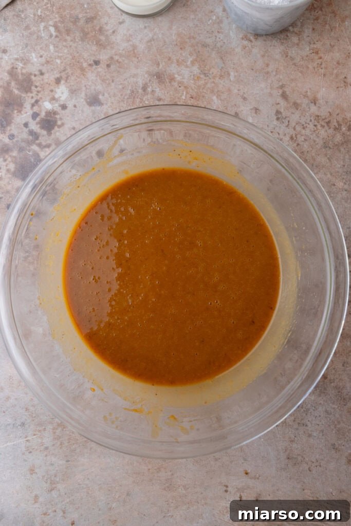 Warm Autumn Pumpkin Streusel Loaf 9 wet ingredients in a bowl