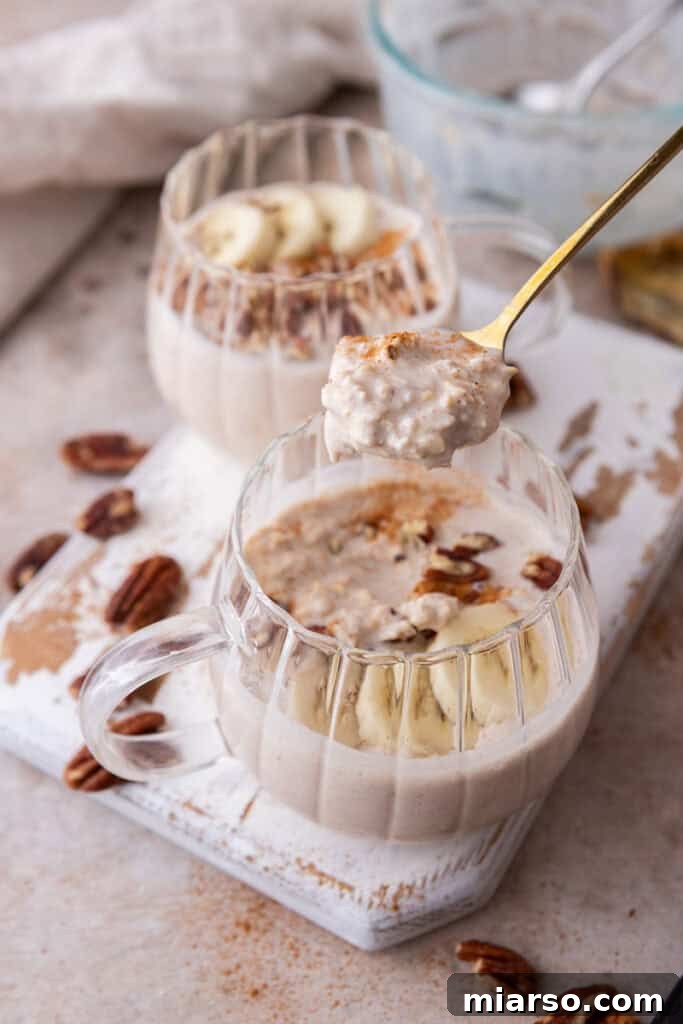 High Protein Overnight Oats recipe in a bowl being scooped with a spoon