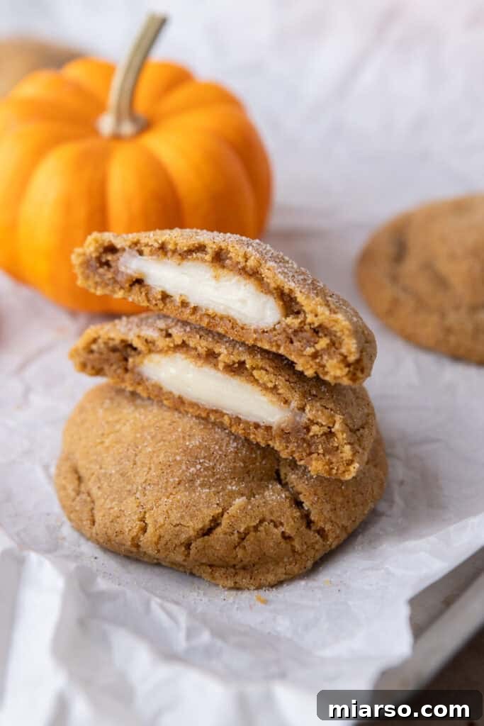 Luscious Pumpkin Cheesecake Cookies 16 Pumpkin Cheesecake Cookies stacked on each other