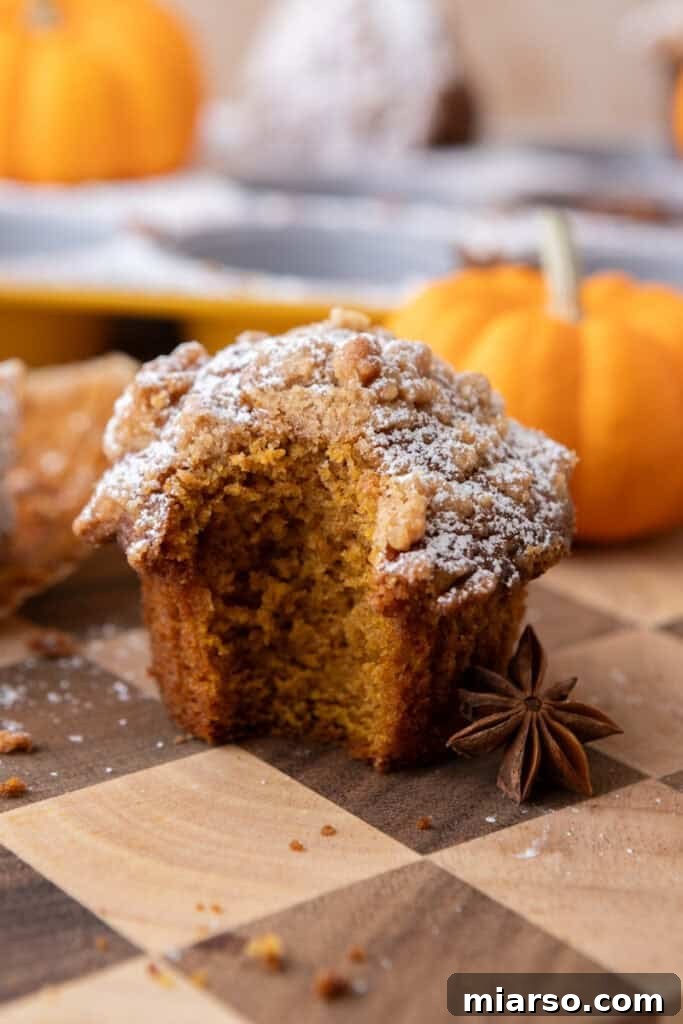 Soft Bakery Pumpkin Muffins Inspired by Panera 2 Panera Bread Pumpkin Muffins recipe with a bite taken out