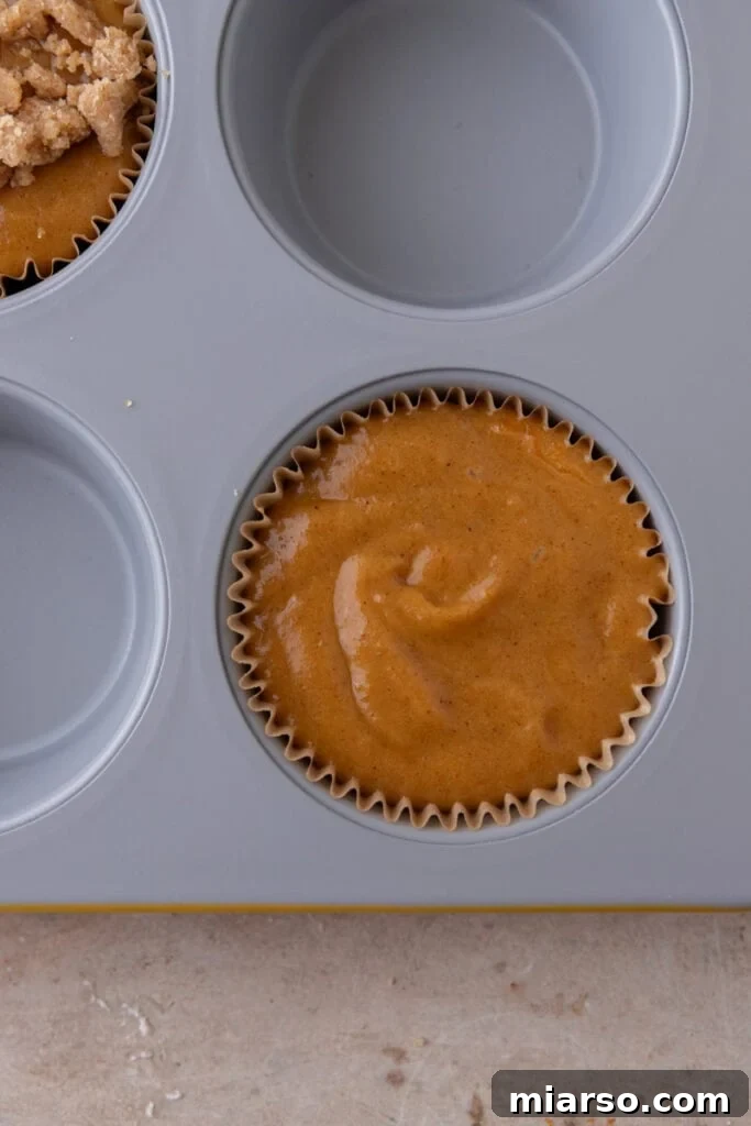 Soft Bakery Pumpkin Muffins Inspired by Panera 11 batter in a pan