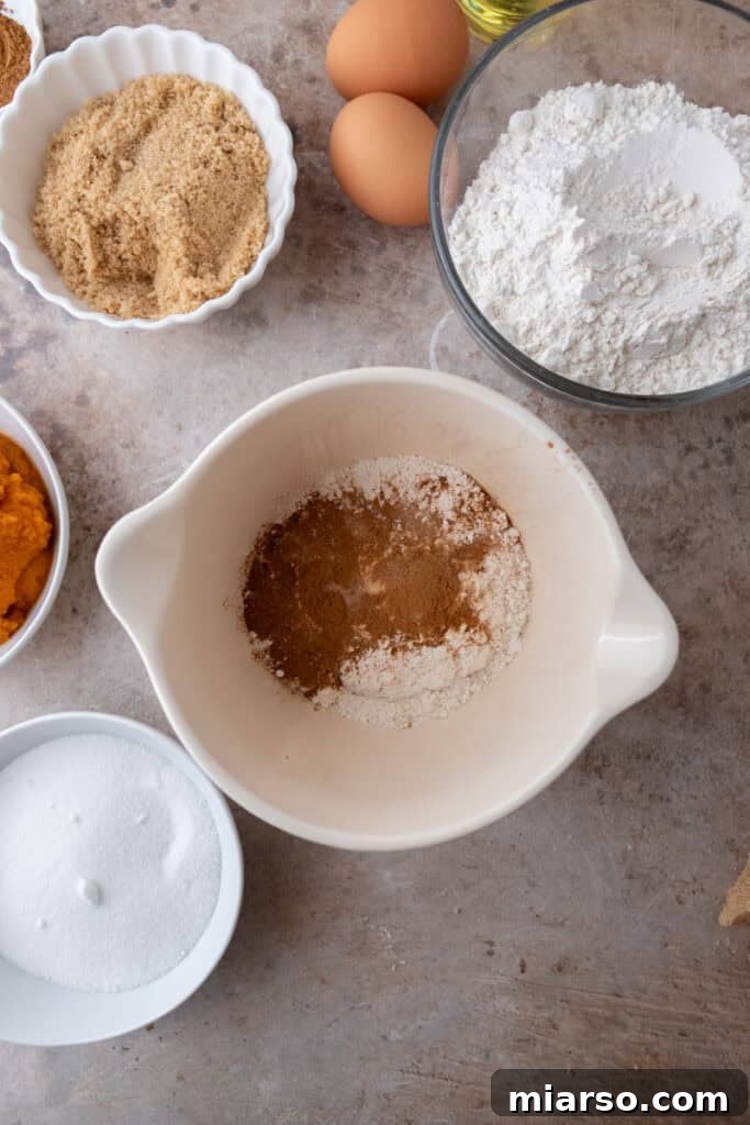 Soft Bakery Pumpkin Muffins Inspired by Panera 7 dry ingredients in a bowl
