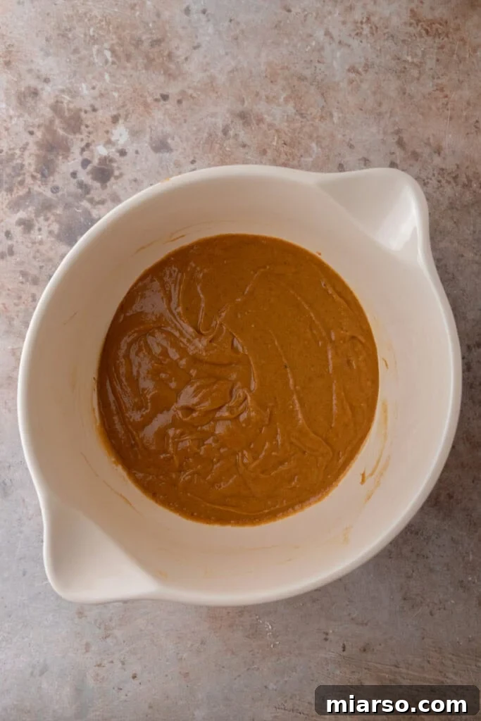 Soft Bakery Pumpkin Muffins Inspired by Panera 10 wet and dry ingredients in a bowl