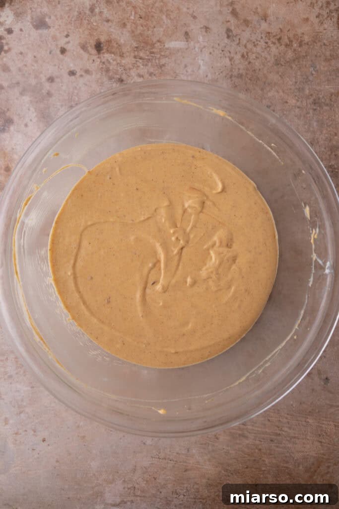 Little Pumpkin Spice Cheesecake Cups 11 filling ingredients in a bowl