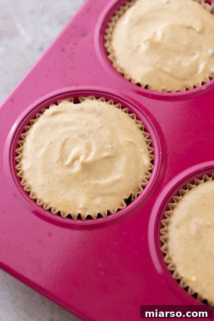 Little Pumpkin Spice Cheesecake Cups 12 filling ingredients in the muffin liners