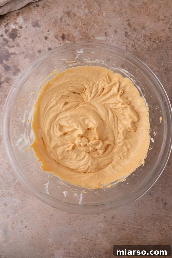 Little Pumpkin Spice Cheesecake Cups 14 filling ingredients in a bowl