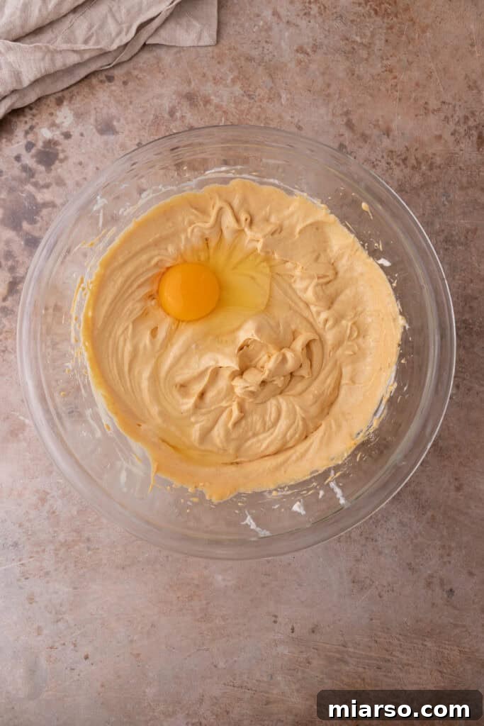 Little Pumpkin Spice Cheesecake Cups 15 filling ingredients in a bowl