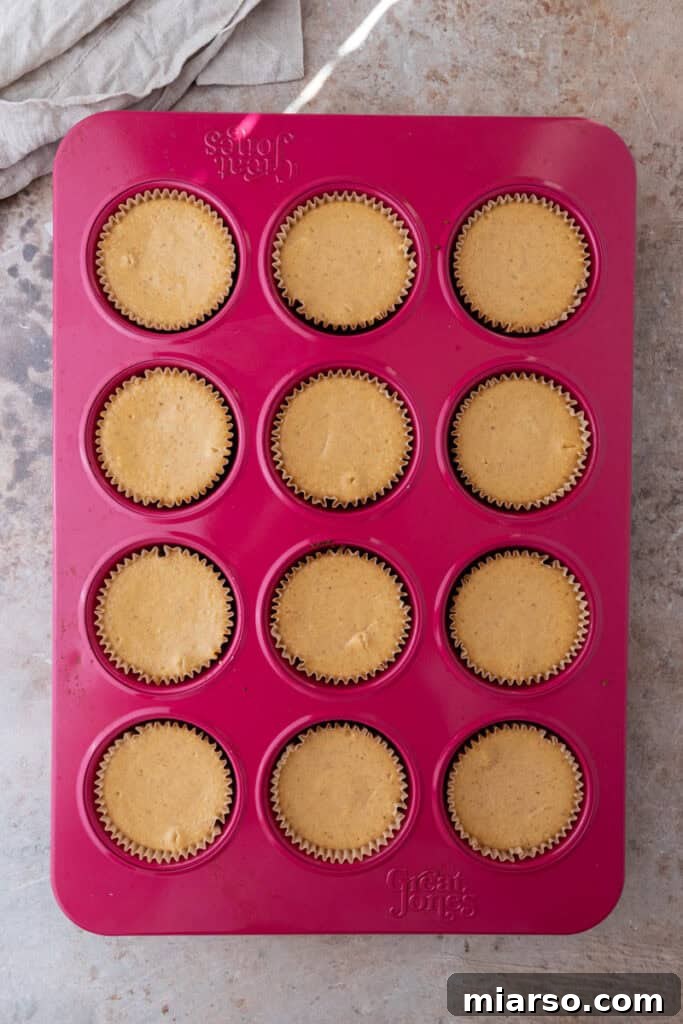 Little Pumpkin Spice Cheesecake Cups 17 baked filling in the muffin liners
