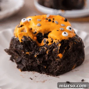Halloween Black Cocoa Cinnamon Roll on a plate