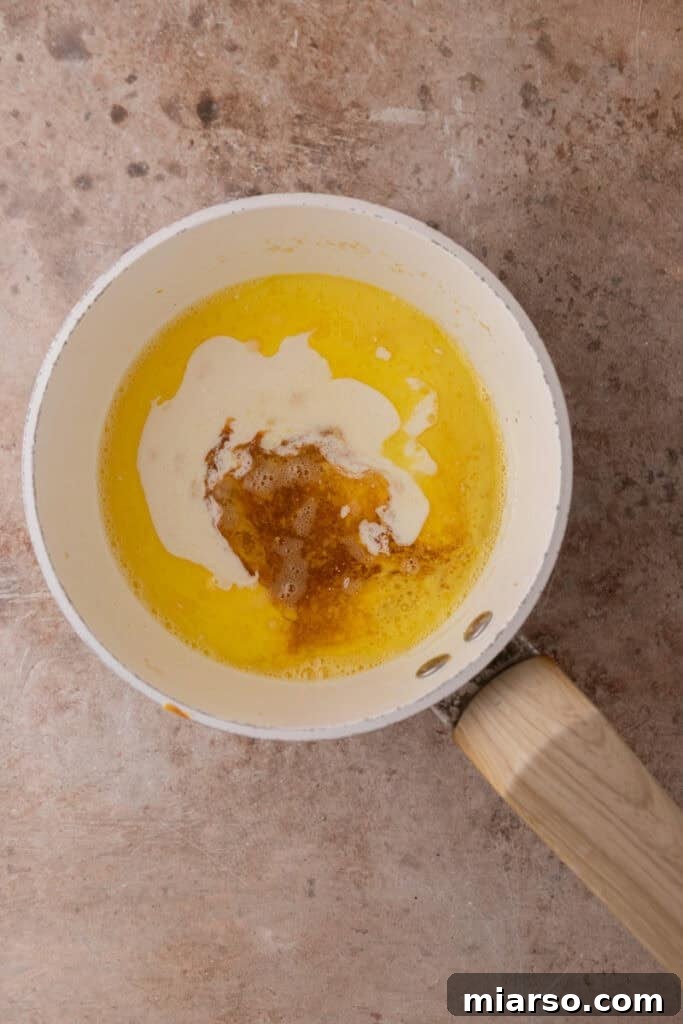 Butter melting in a saucepan over low heat, the first step for the pecan pie topping.