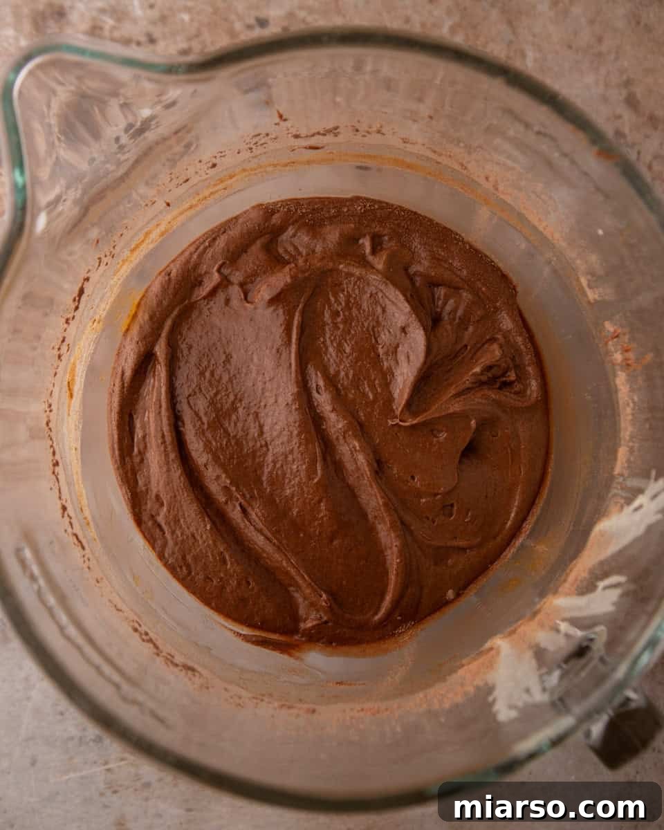 Ina Garten's Viral Brownie Pudding Sensation 7 Smooth and thick chocolate brownie pudding batter, perfectly mixed and ready for baking.