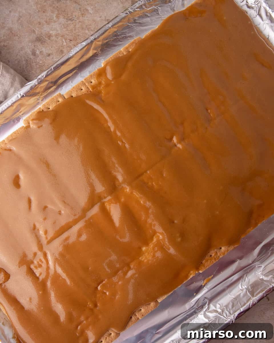 Toffee poured over graham crackers for Christmas crack