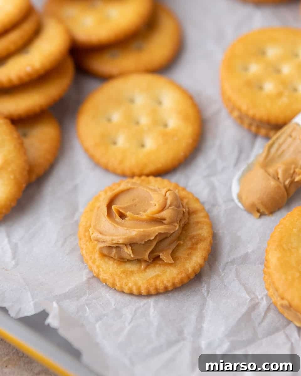 Ritz crackers topped with creamy peanut butter for peanut butter cookies