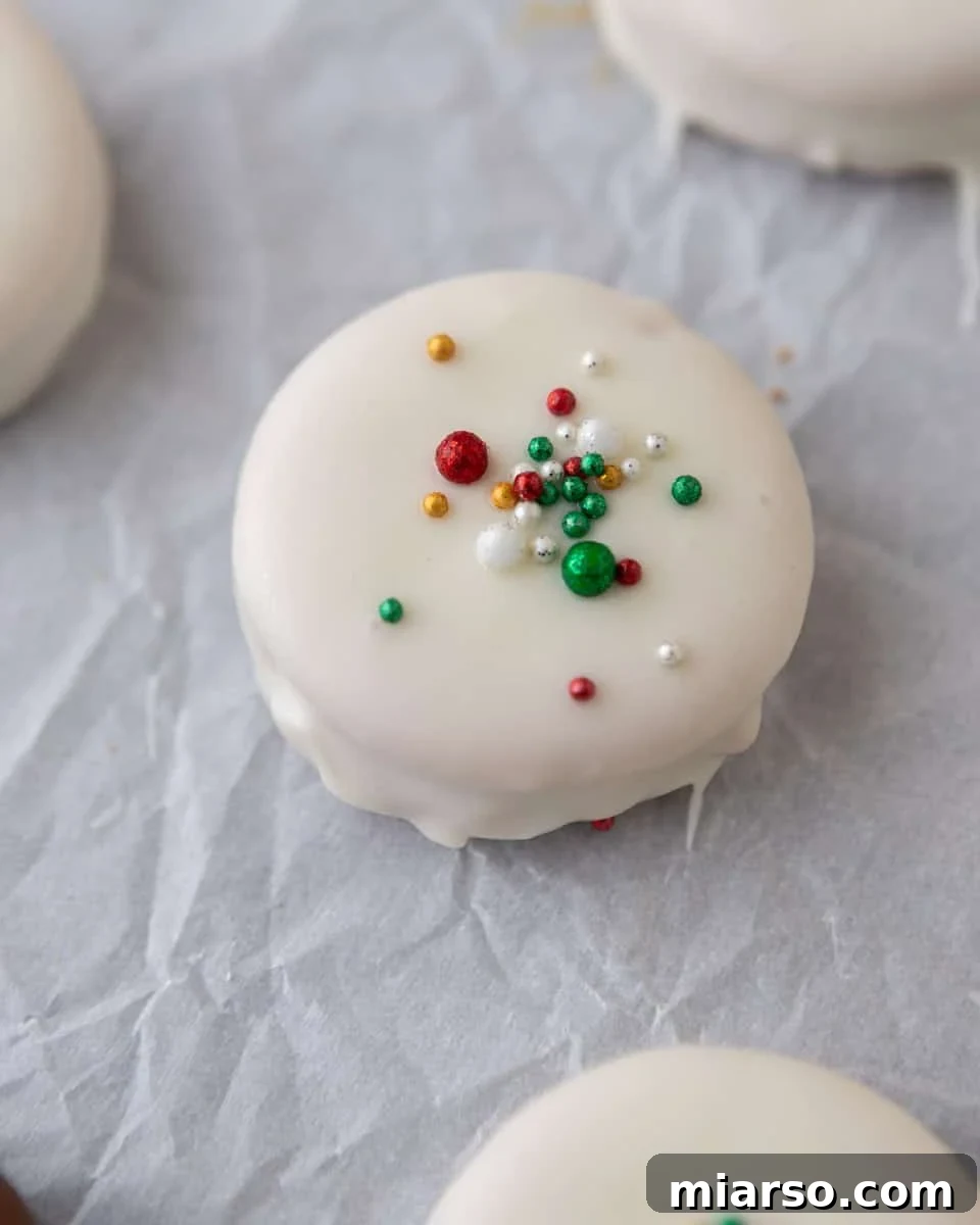 Ritz cookies dipped in white chocolate and topped with festive holiday sprinkles