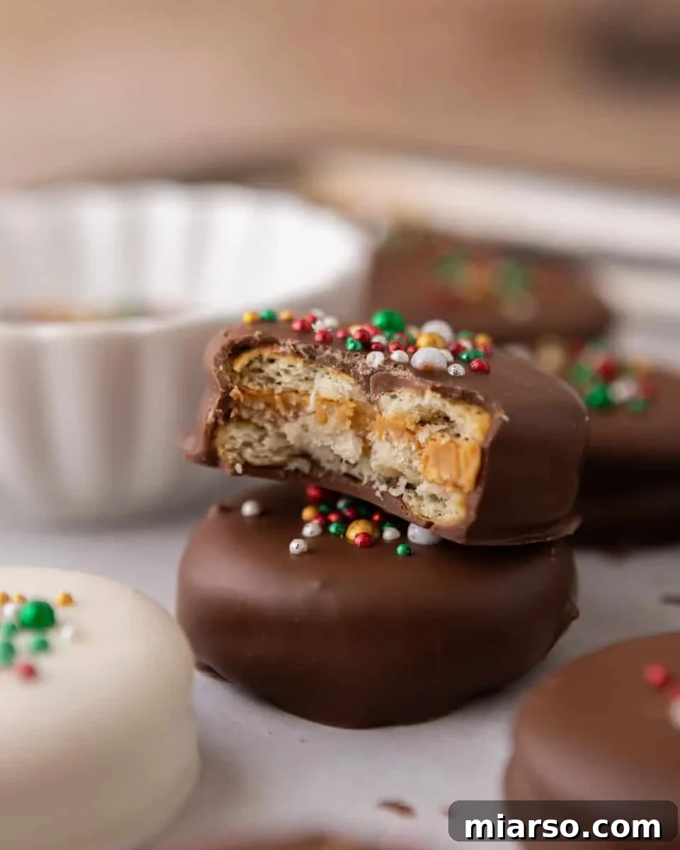 Stacked Ritz peanut butter cookies showing chocolate shell and peanut butter center