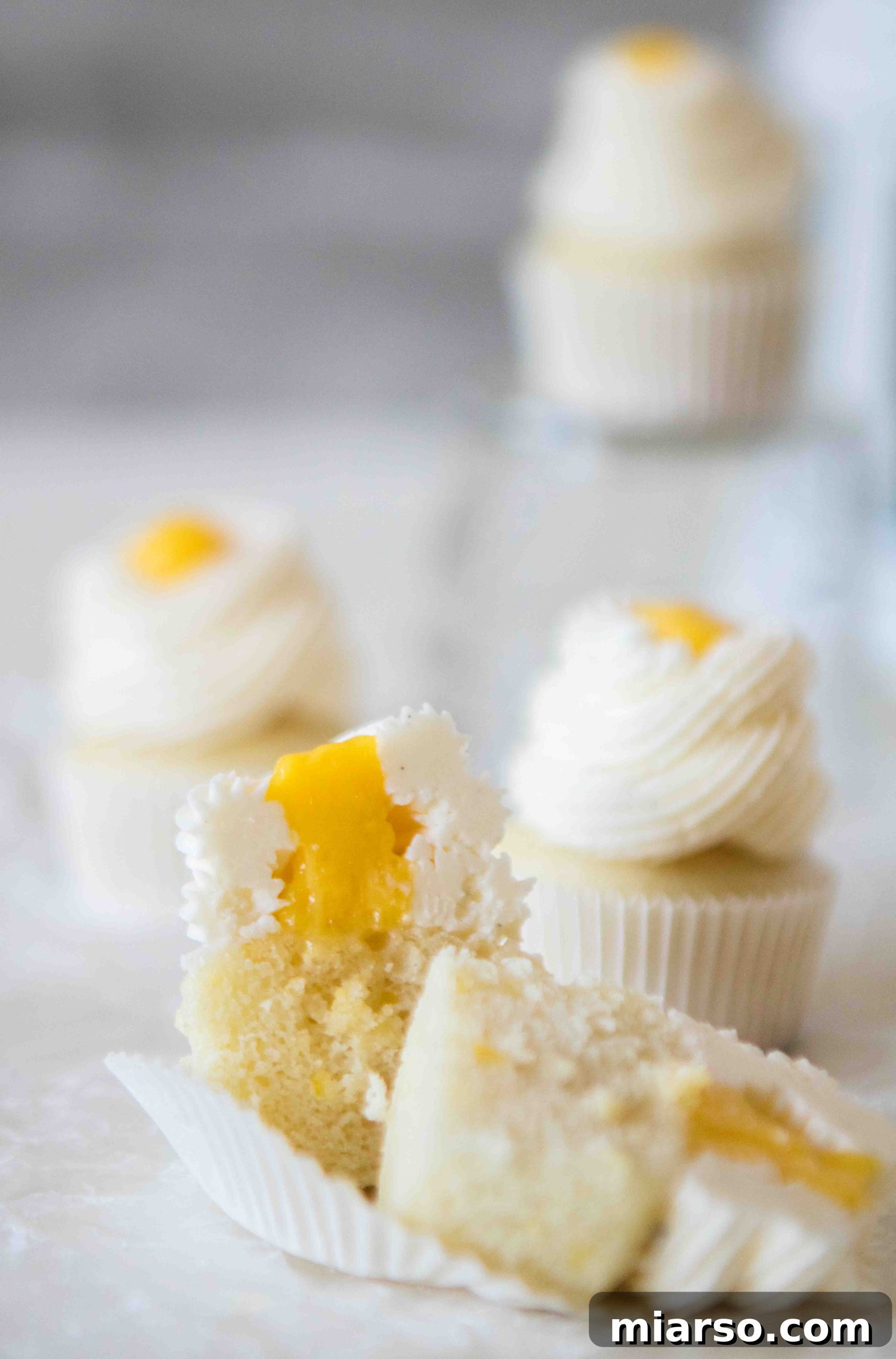 Lemon curd filled mini lemon cupcakes
