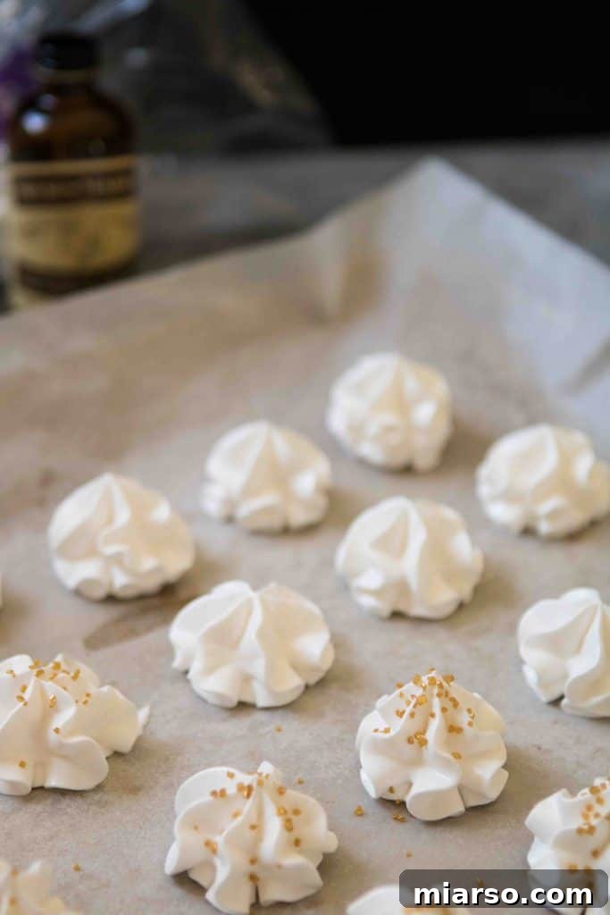 Piping meringue onto baking sheet