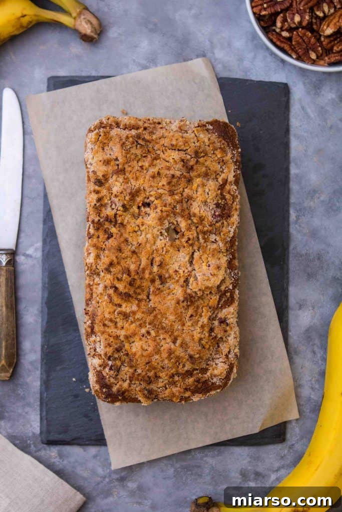Close-up of a streusel-topped sweet bread, showcasing its golden crust and crumbly texture