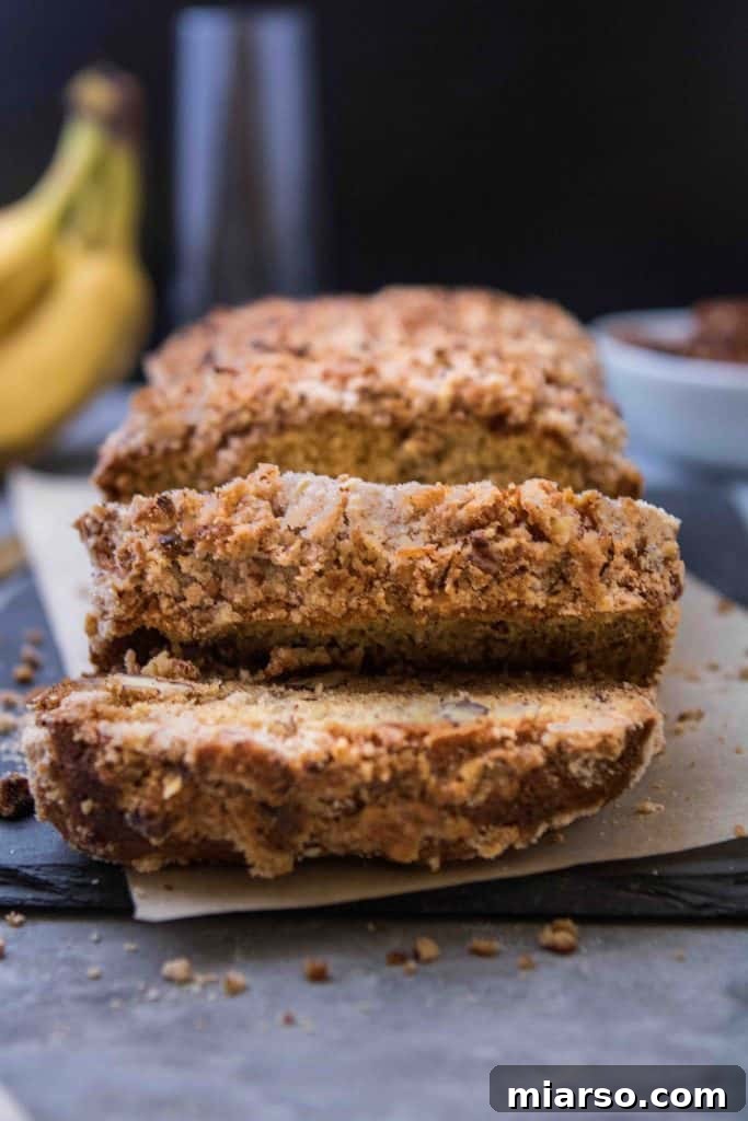 A beautifully baked loaf of banana bread, showcasing its golden-brown crust and inviting texture