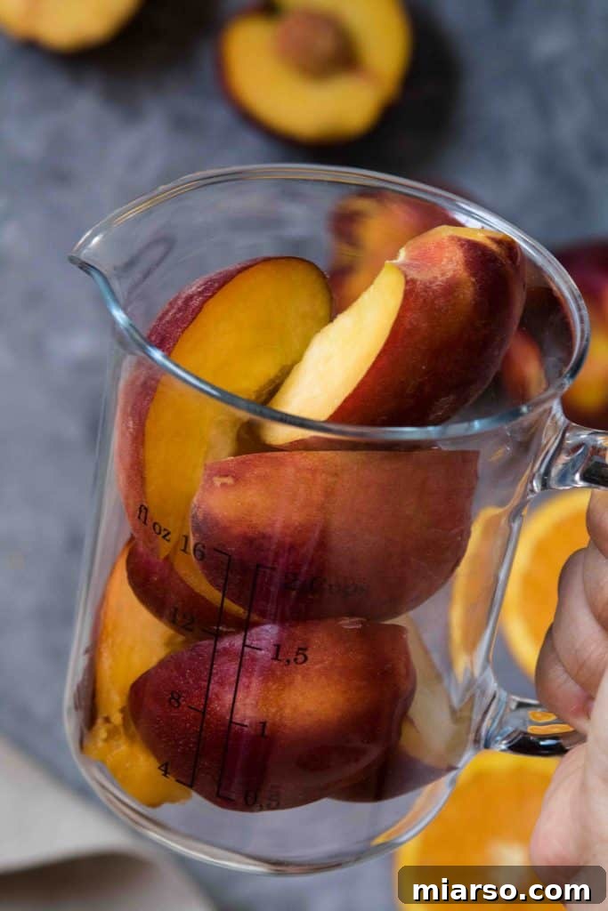Citrus Peach CBD Serenity Smoothie 4 Close-up of a glass of refreshing summer peach smoothie infused with CBD