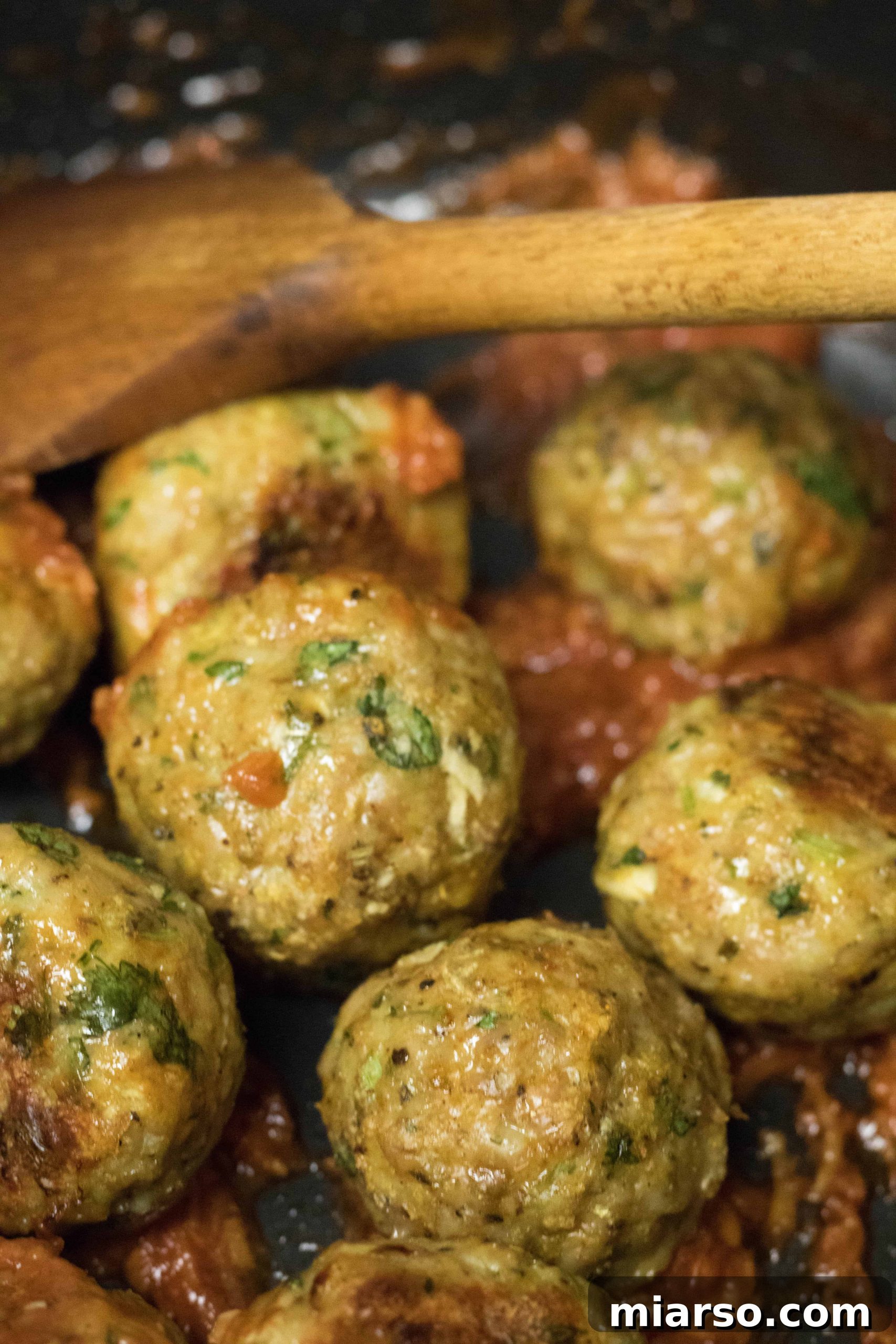 Baked Indian Chicken Meatballs arranged with fresh cilantro