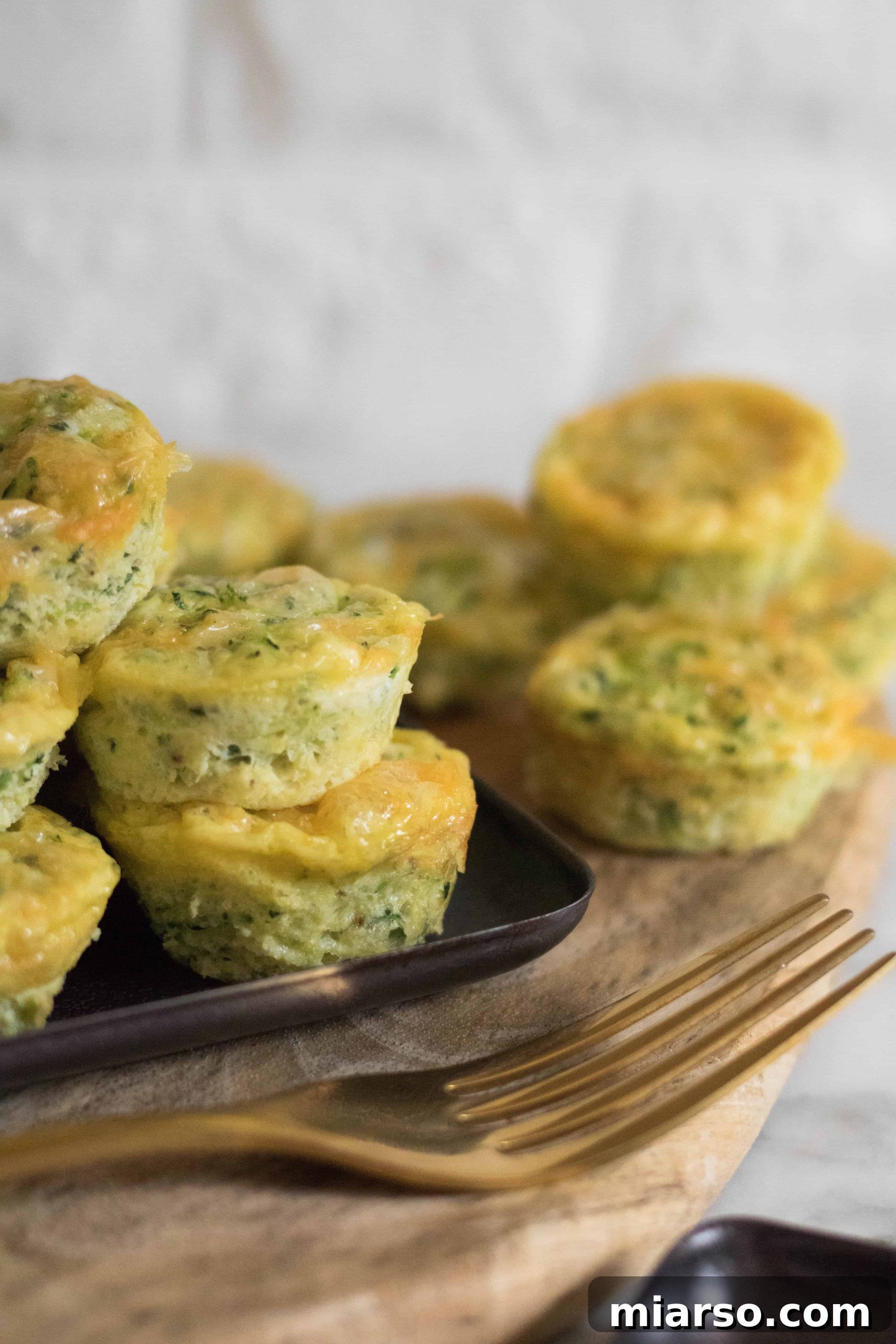 Speedy Zucchini Frittata Muffins 4 Closeup of mini zucchini frittatas cooling on a rack, showcasing their fluffy texture