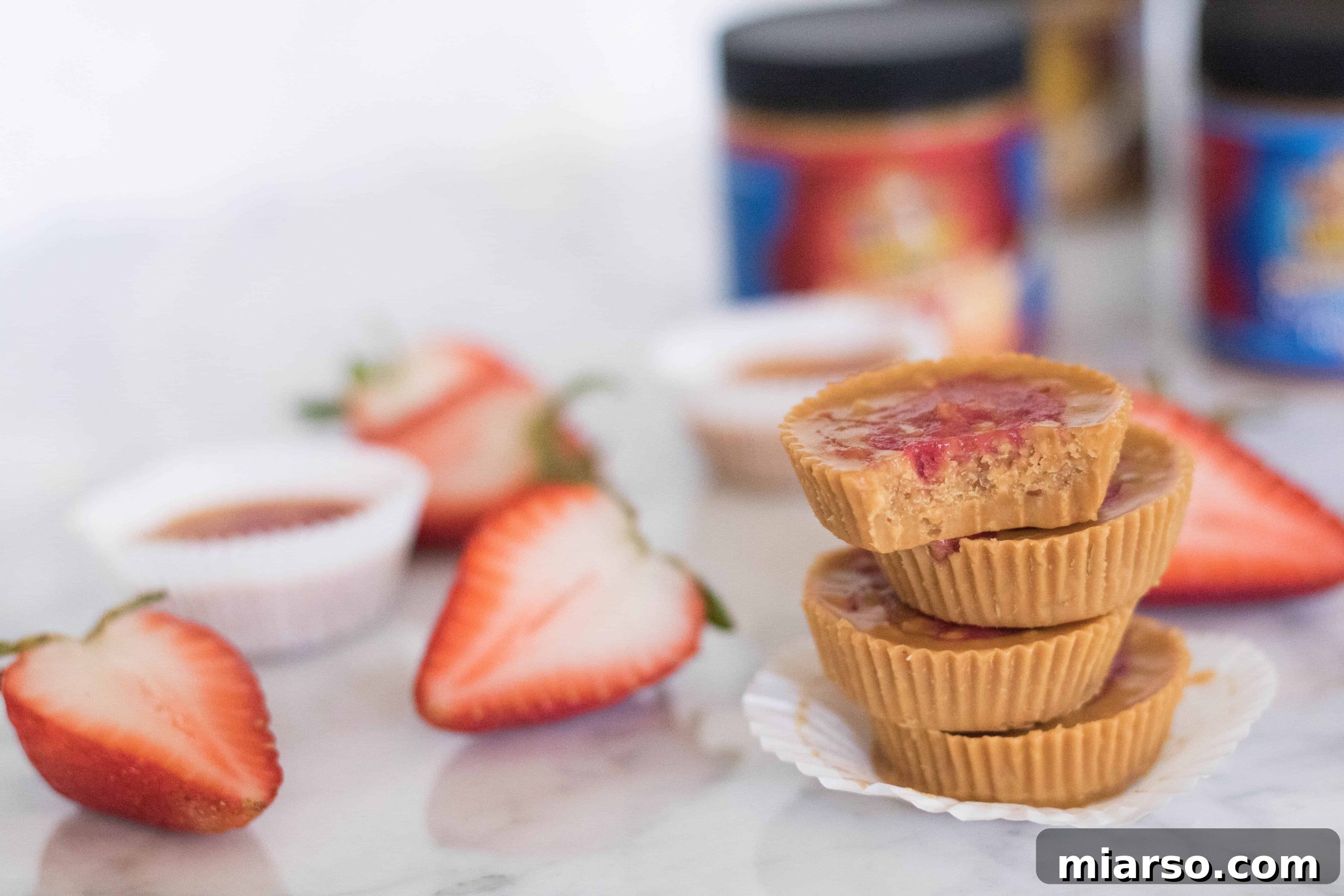 Stacked healthier peanut butter and jelly swirl cups, perfect for a healthy snack
