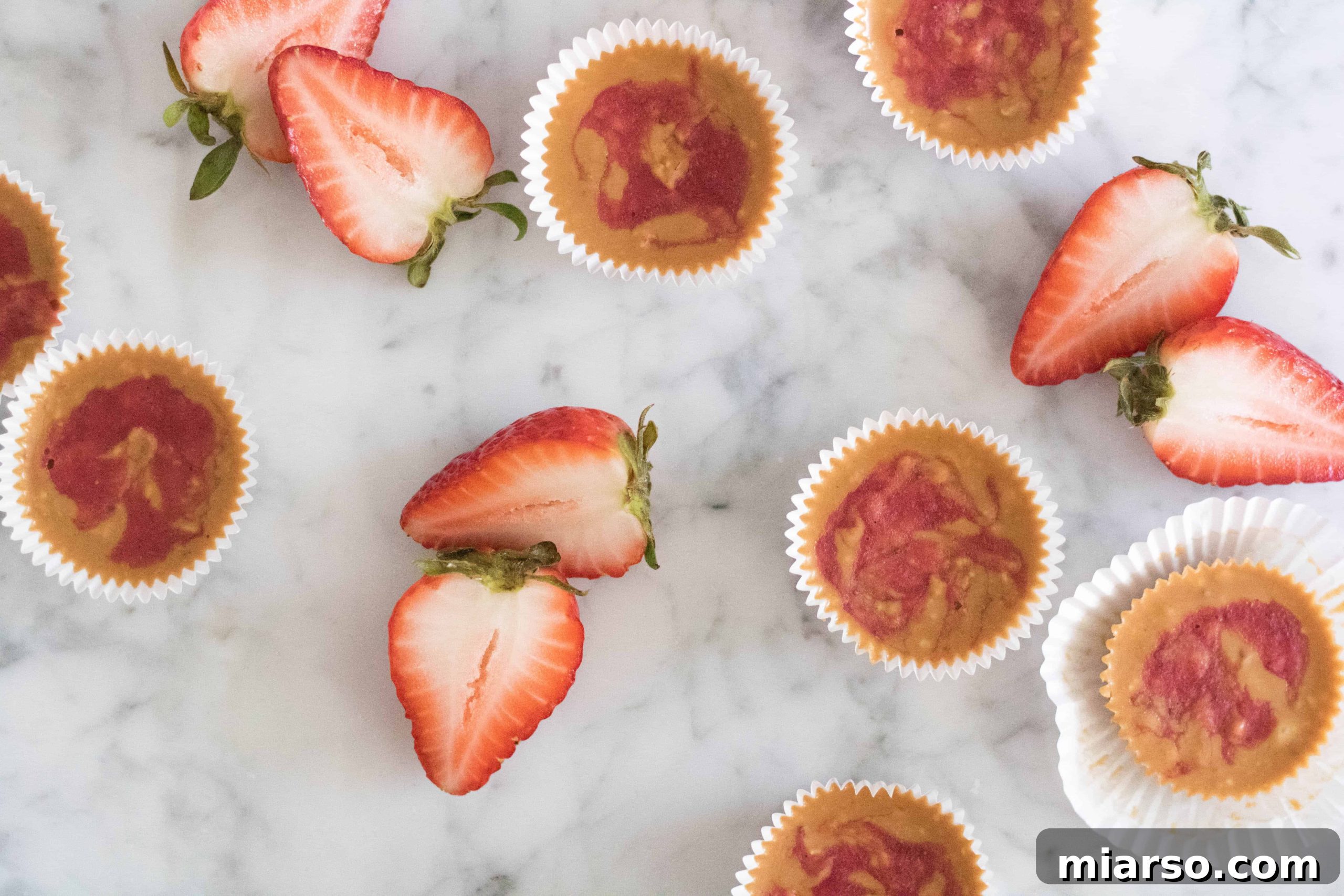 Overhead shot of freshly made healthier peanut butter and jelly swirl cups, showcasing their homemade appeal