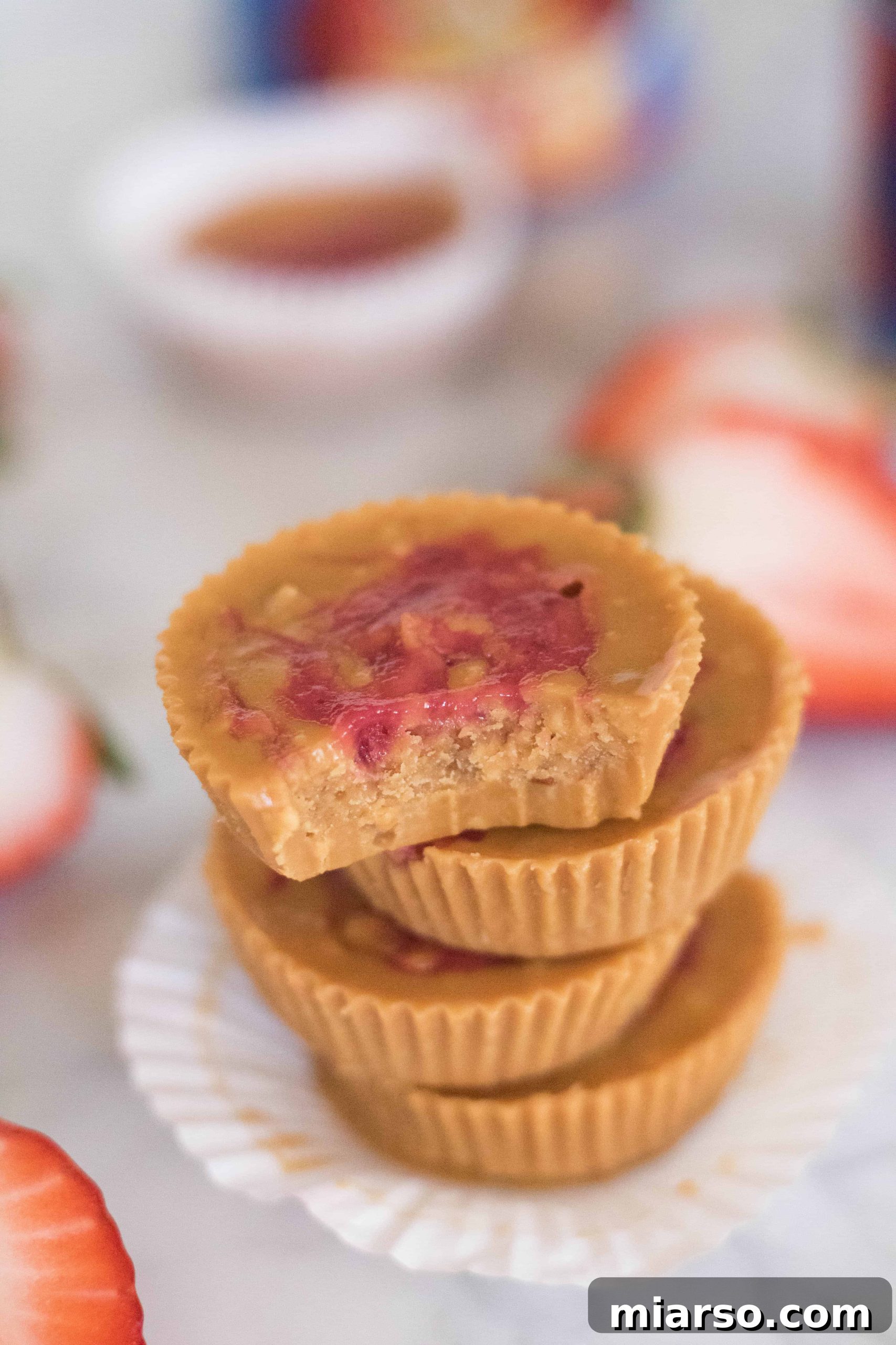 Birds eye view and close up of the healthier peanut butter and jelly cups, highlighting the swirl and texture