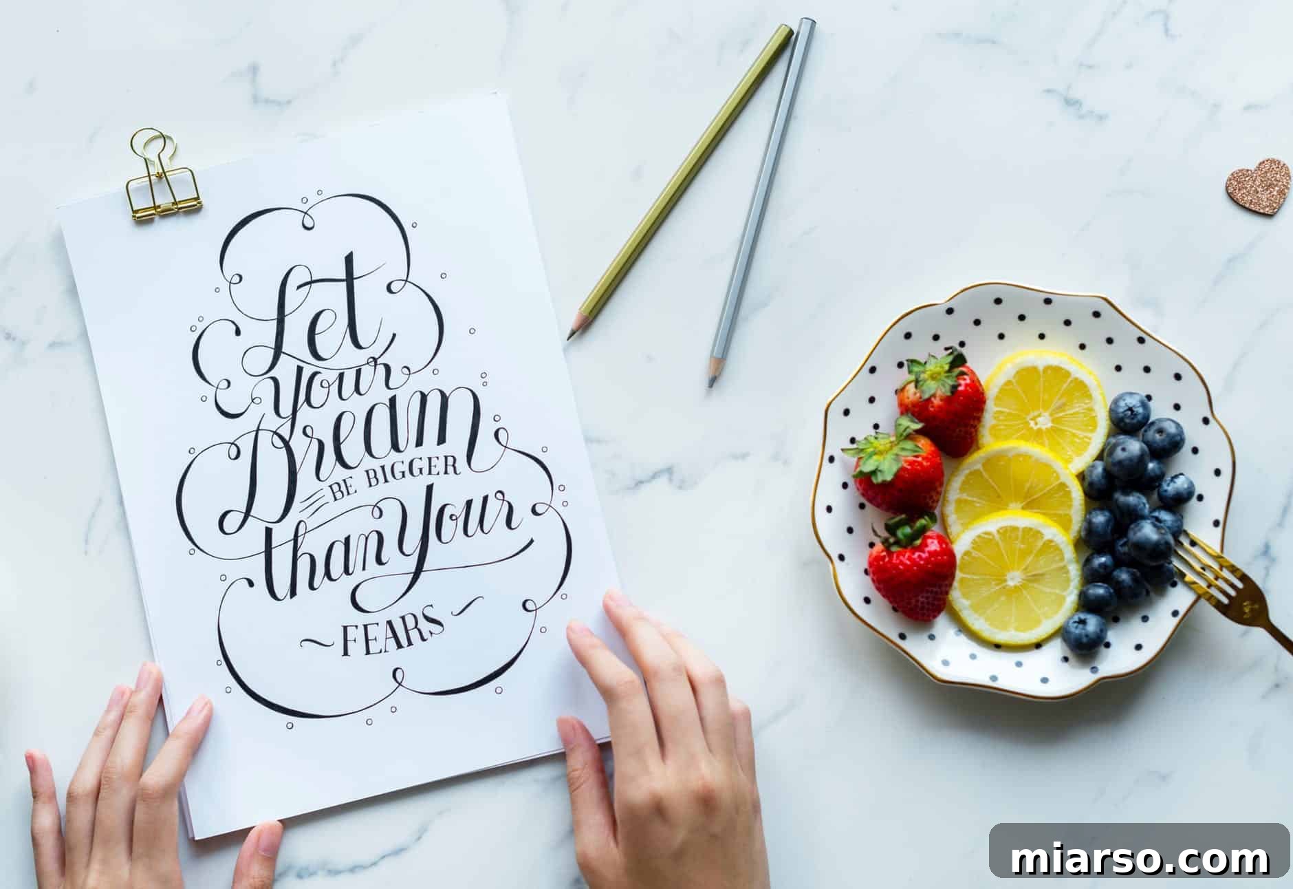 A food blogger researching influencer websites like Influenster on their computer to find brand collaborations.
