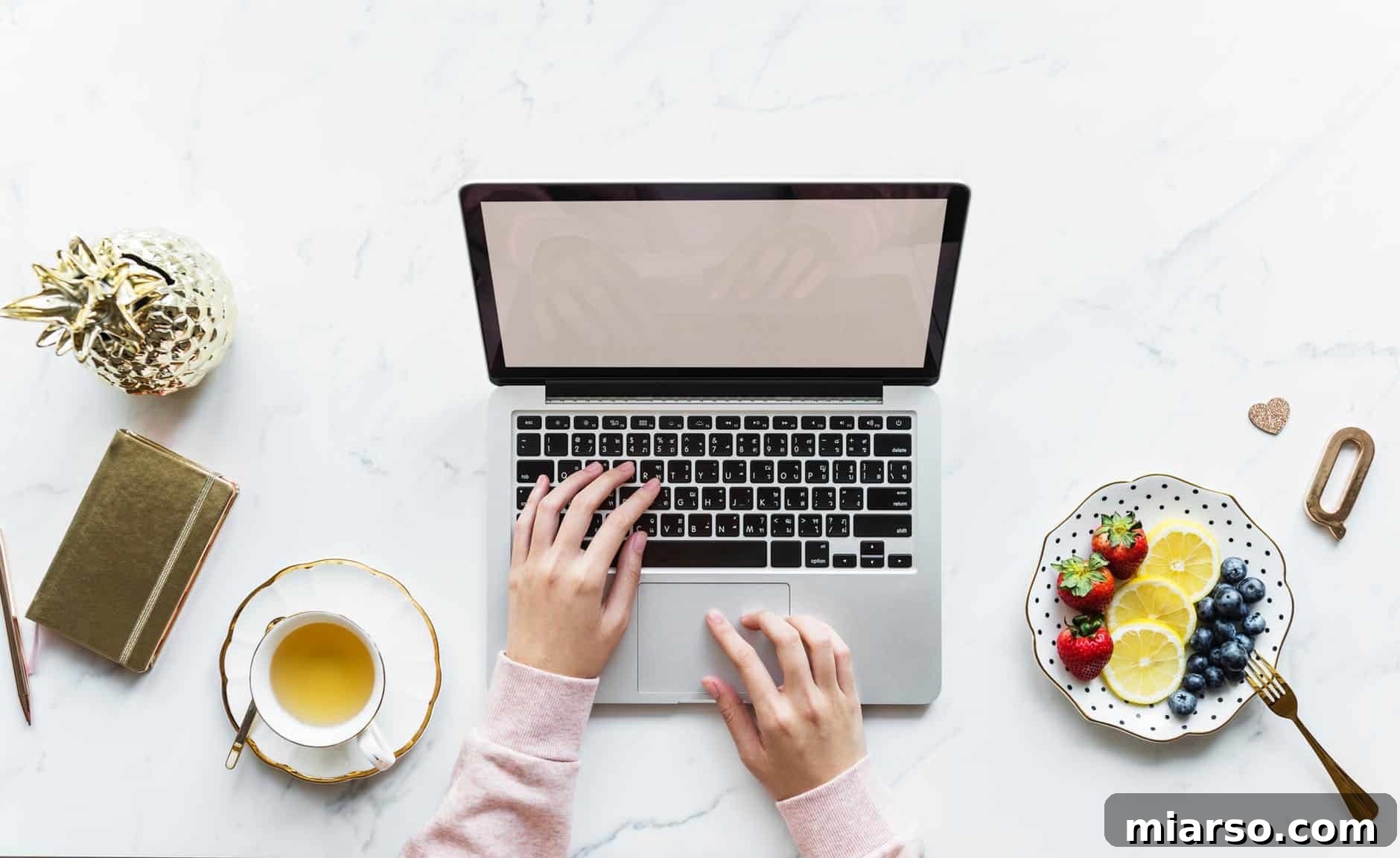 A food blogger at their computer, researching how to get free products and sponsorships for their blog.