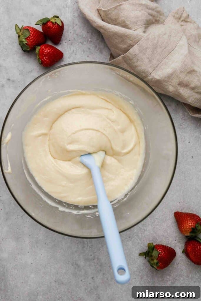 Mixing the wet and dry ingredients gently together