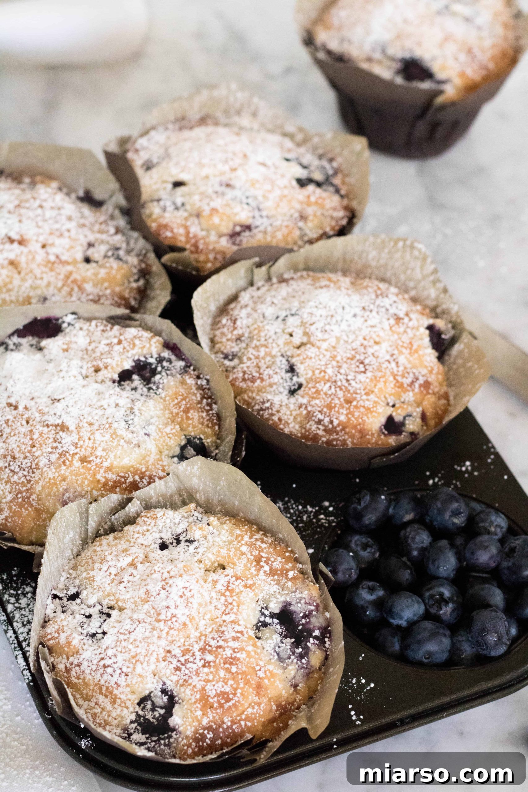 Artisan Blueberry Streusel Muffins 5 A basket full of warm, freshly baked Bakery Style Blueberry Muffins.