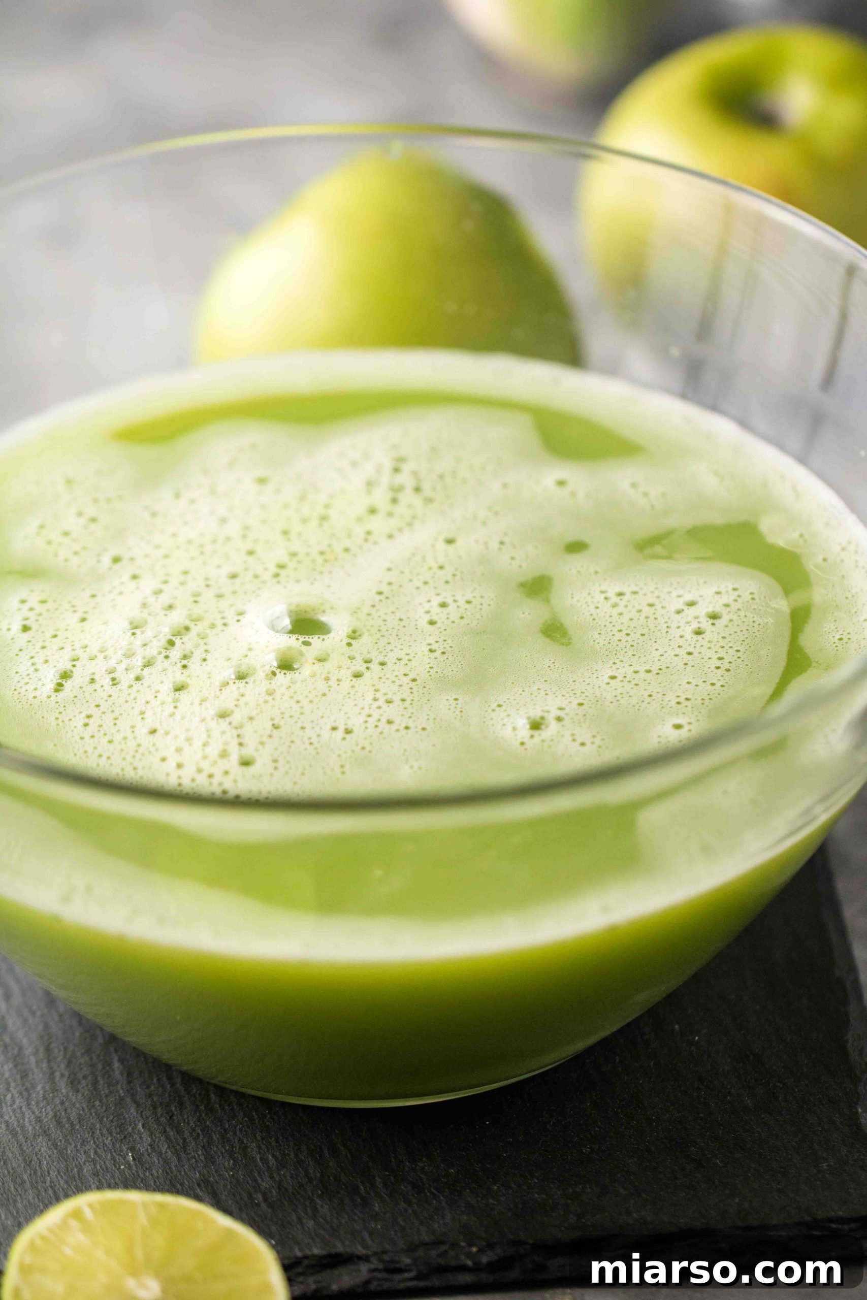 Freshly made green juice in a glass bottle