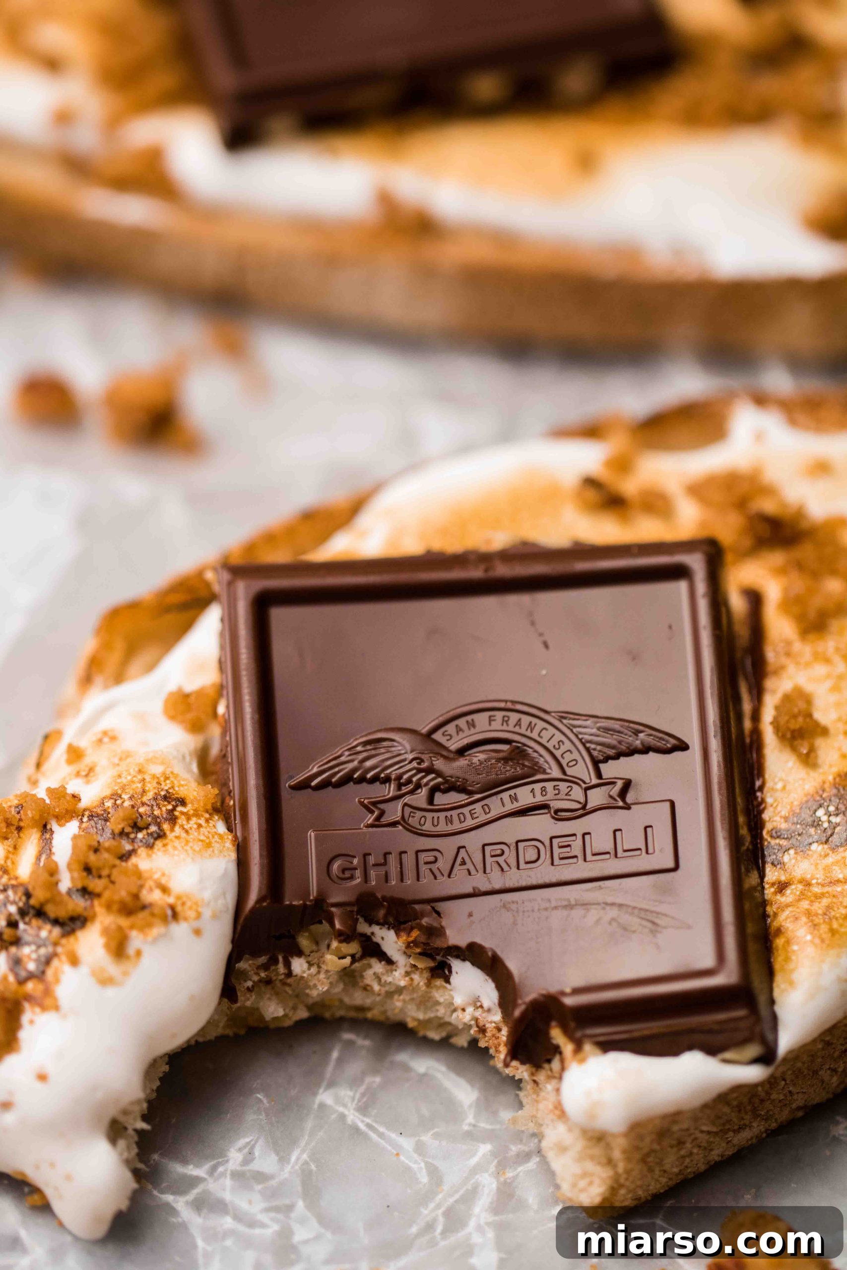 A plate of two fancy s'mores toasts, ready for serving