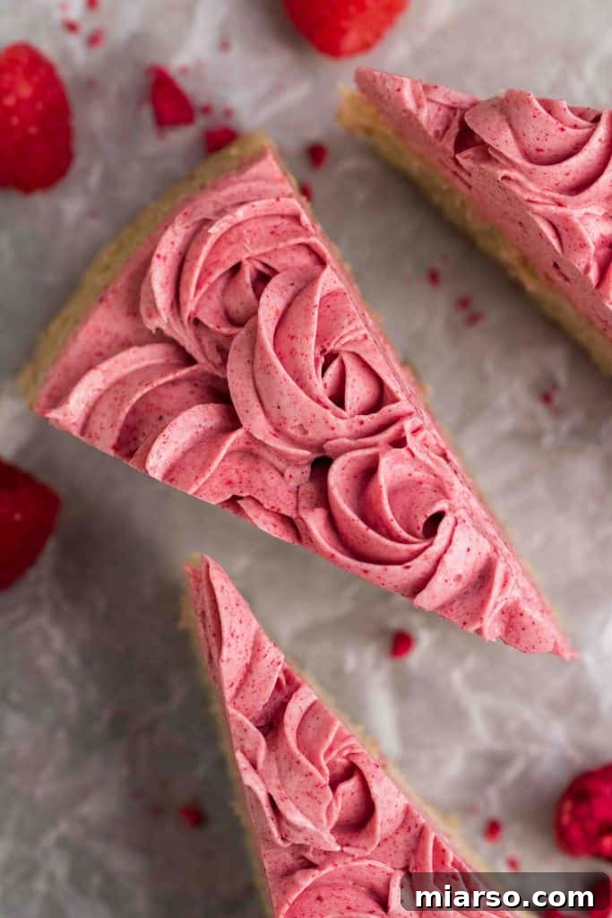Raspberry Bliss Cake with Silky Buttercream 11 Beautiful pink cake with raspberry frosting, ready to be served