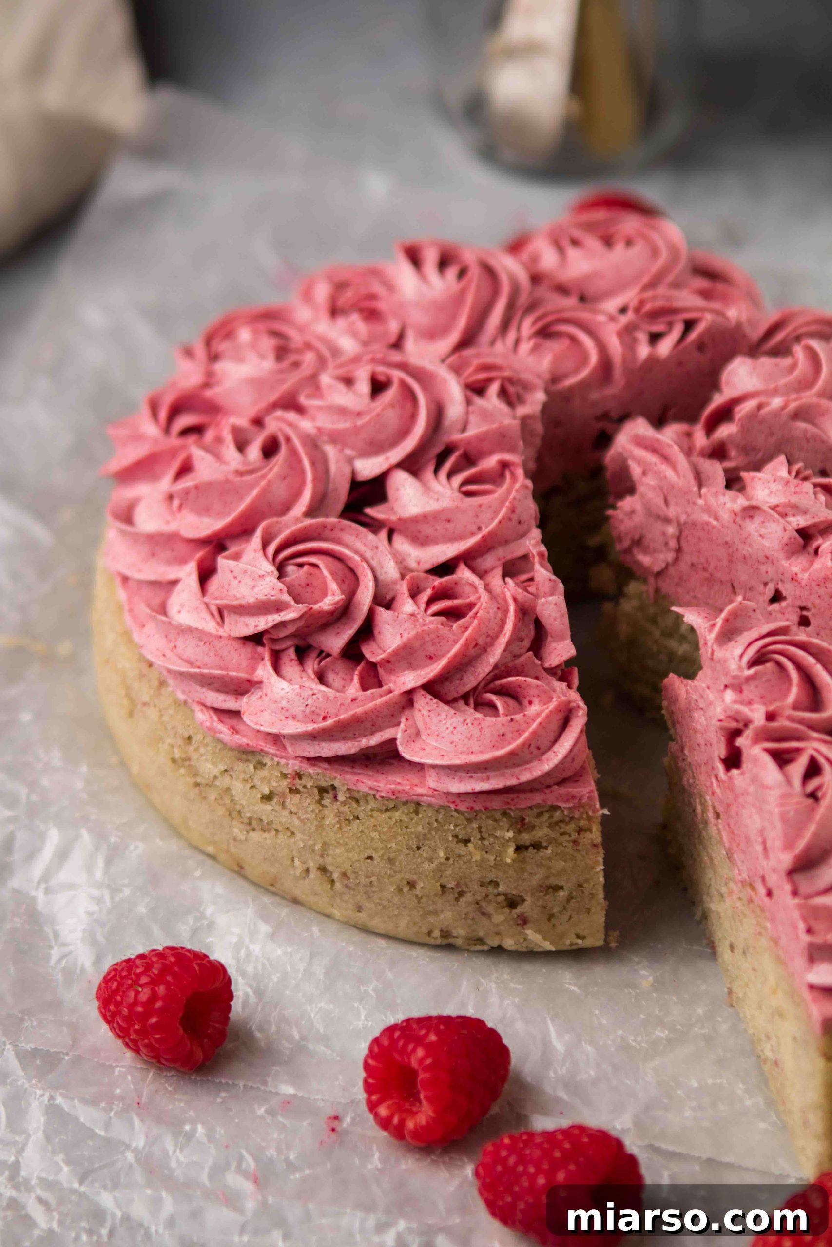Raspberry Bliss Cake with Silky Buttercream 8 Close-up of easy and delicious cake with pink raspberry frosting rosettes