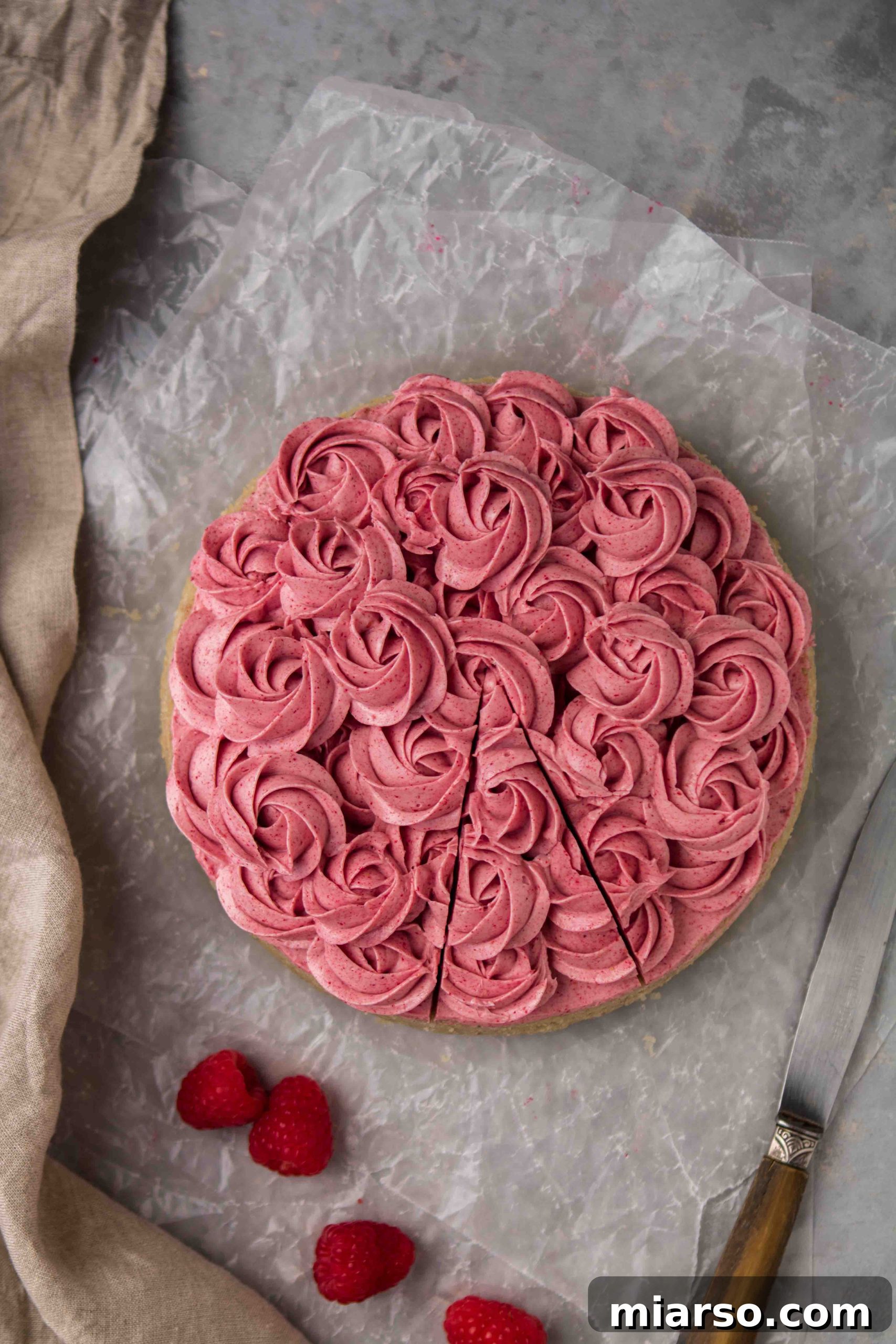 Raspberry Bliss Cake with Silky Buttercream 9 Delicious pink raspberry frosting piped on a butter cake